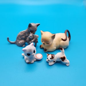Four Miniature Cat Figurines