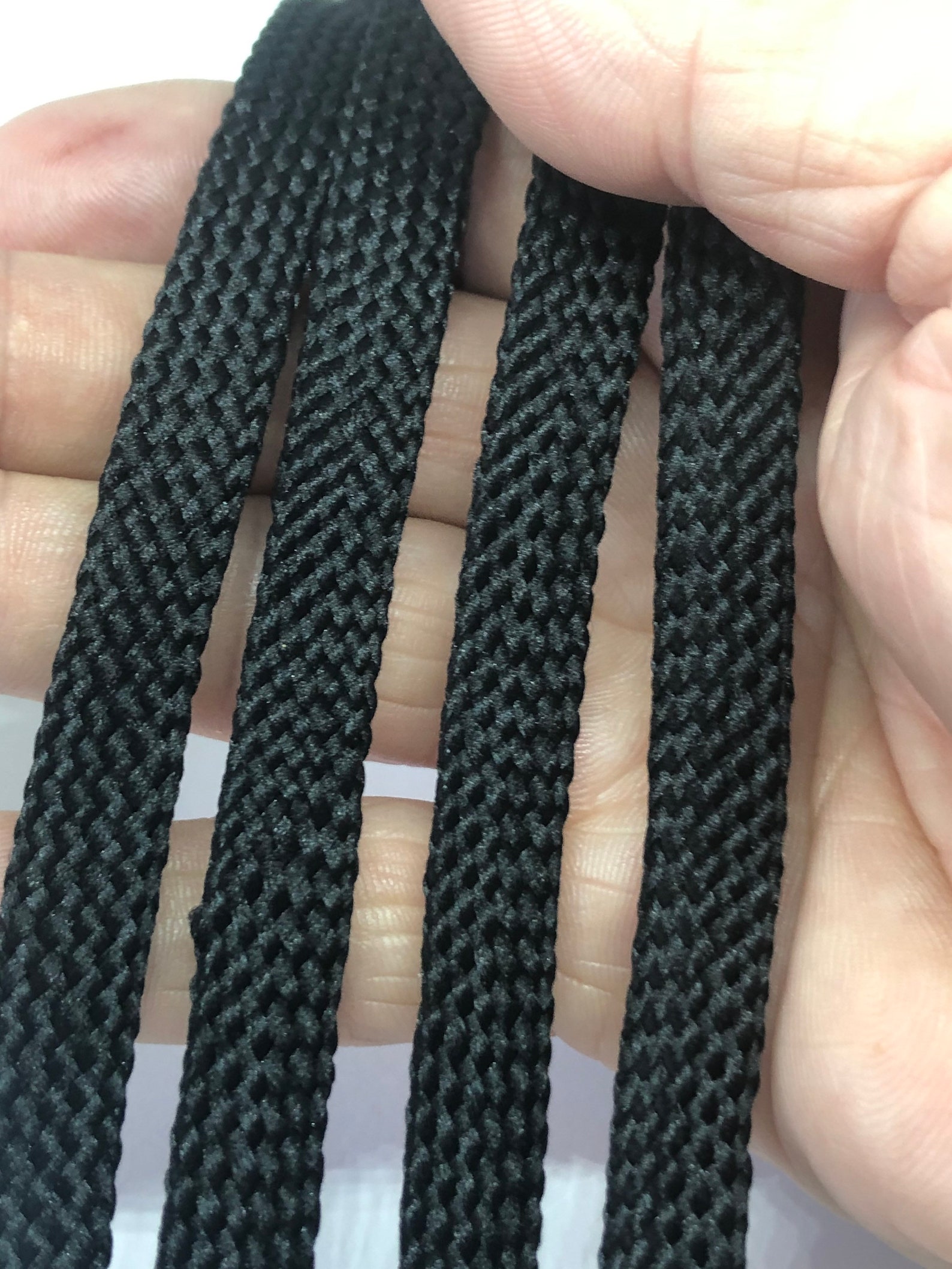 black shoelaces with silver tips