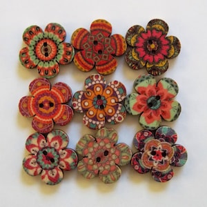 May include: Nine wooden flower-shaped buttons with colorful mandala designs. The buttons have two holes each and are approximately 1 inch in diameter.