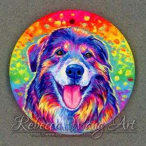 May include: A colorful painting of a dog's face. The dog has a white face with blue and purple fur. The background is a rainbow of colors with yellow, orange, red, green, blue, and purple.