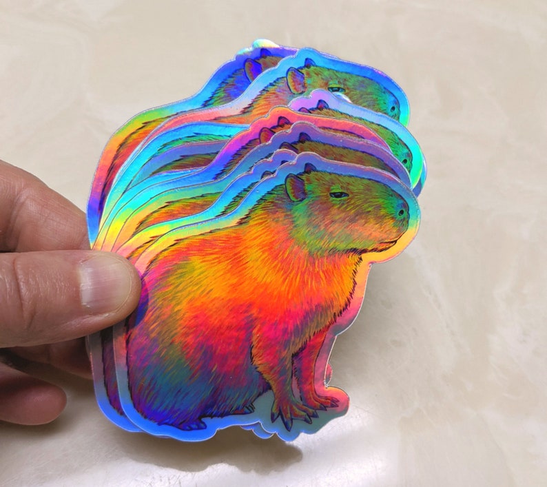 Psychedelic rainbow capybara vinyl die cut holographic sticker