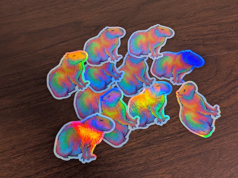 Psychedelic rainbow capybara vinyl die cut holographic sticker