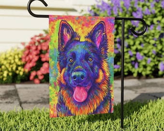 May include: A colorful garden flag featuring a German Shepherd dog with a rainbow-colored fur pattern. The dog's face is the main focus of the image, with its tongue sticking out and a friendly expression.