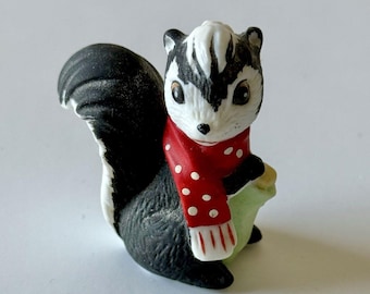 Vintage Porcelain SKUNK Figurine Matte Finish Christmas Red Scarf With Stocking
