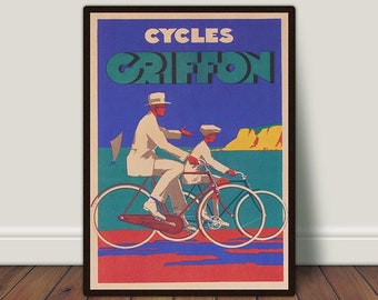 May include: Vintage poster print depicting two people on bicycles. The poster reads "CYCLES GRIFFON" at the top. The figures are dressed in white suits and hats. The background shows a blue sky, water, and yellow cliffs. The bottom of the poster has the text "Vibrant Vintage Prints".
