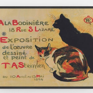 May include: A framed vintage poster featuring two cats and French text. The poster has a tan background with red and green text. The cats are black and calico. The text includes the artist's name, the location, and the dates of the exhibition.