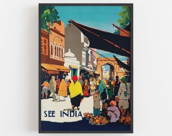 May include: A framed vintage travel poster with the text "SEE INDIA." The illustration depicts a bustling street scene with people in traditional clothing, buildings, and a blue sky. The color palette includes shades of orange, yellow, and blue.
