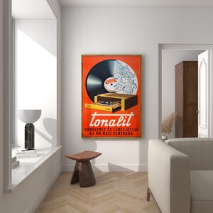 May include: A vintage advertisement for "tonalit" record player and phonograph. The ad features a cartoon illustration of a record player with a record on it, and the text "tonalit" in bold, red letters. The text below reads "hanglemezes es lemezjatszo az on hazi zenekara".