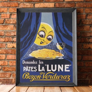 以下が含まれることがあります： 「P&acirc;tes La "Lune" Bozon-Verduraz」パスタのヴィンテージ広告。広告には顔のある漫画の月とパスタの皿が描かれています。テキスト「Demandez les P&acirc;tes La "Lune" Bozon-Verduraz」はフランス語で書かれています。
