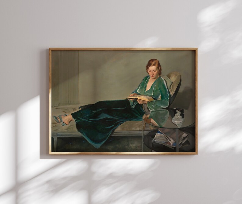 May include: A painting of a woman in a green velvet robe reclining on a chaise lounge and reading a book. She is wearing a pair of blue shoes and has red hair. The painting is set in a room with a side table and a vase of flowers.