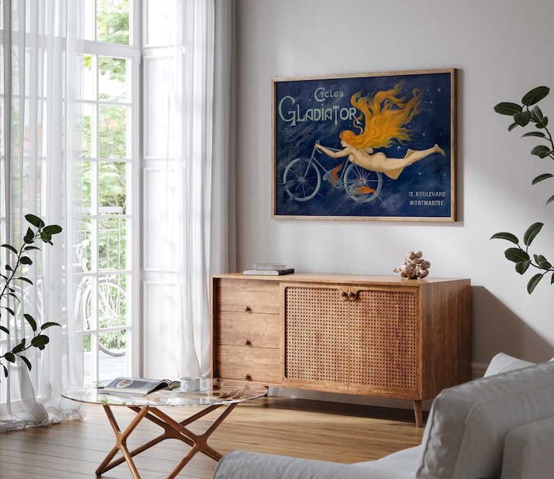May include: Vintage poster advertising Gladiator bicycles. The poster features a woman with flowing red hair riding a bicycle against a dark blue background with stars. The text on the poster reads "Cycles Gladiator 17, Boulevard Montmartre".