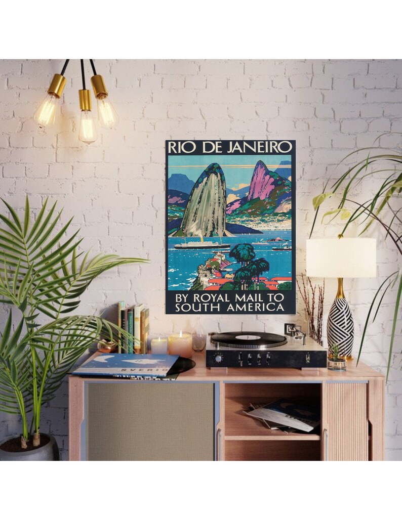May include: Vintage travel poster advertising a trip to Rio de Janeiro, Brazil by Royal Mail to South America. The poster features a colorful illustration of Sugarloaf Mountain and Guanabara Bay.