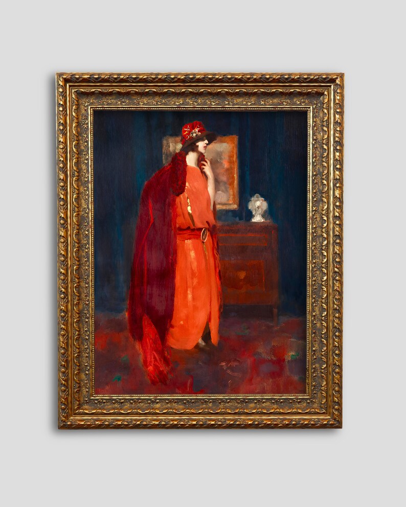 May include: A painting of a woman in a red dress and a red hat standing in a room with a dark blue wall. She is looking to the right and holding a fan in her left hand. There is a dresser with a lamp on it in the background.