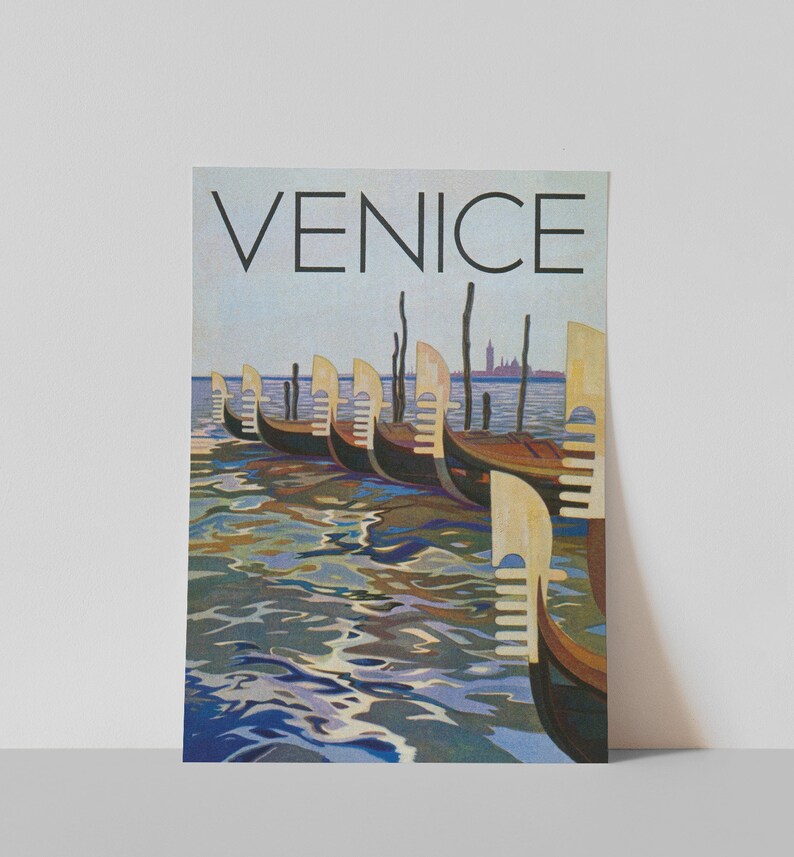 May include: A vintage travel poster featuring the word "VENICE" in large black letters above a row of gondolas on the water. The gondolas are brown and black, with light-colored decorative elements. The water reflects the sky and gondolas.