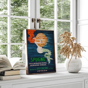 May include: Vintage poster advertising sponges with a mermaid holding a large sponge. The poster is in blue, green, yellow, and red colors. The text reads "Spugne,  Pelica Lavorazione Propria, Esportazione Mondiale, Benedetto Brignone & Figli, Venezia".