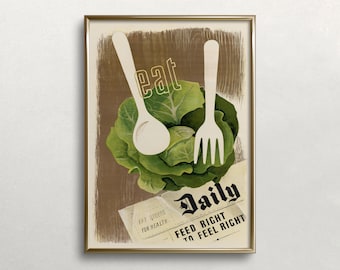 May include: A framed vintage-style print featuring a green cabbage, a spoon, and a fork. The word "eat" is above the cabbage, and a newspaper clipping with the words "Daily" and "Feed Right to Feel Right" is below. The print is in a gold frame.