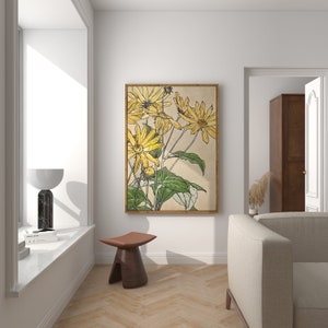 May include: A framed print of a botanical illustration featuring yellow flowers with green stems and leaves on a beige background.