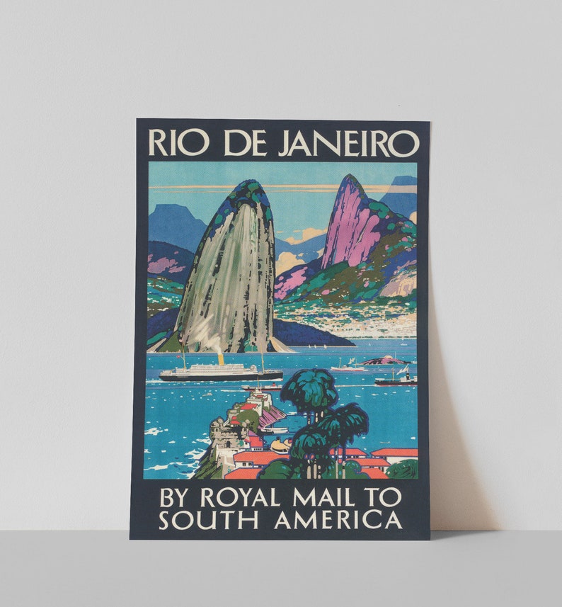 May include: Vintage travel poster advertising a trip to Rio de Janeiro, Brazil by Royal Mail to South America. The poster features a colorful illustration of Sugarloaf Mountain and Guanabara Bay with a ship in the water.