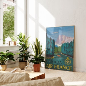 May include: A vintage travel poster featuring a scenic landscape with mountains, trees, and a river. The poster is in blue, green, and yellow tones and has the text "CANADA AIR FRANCE" at the bottom.