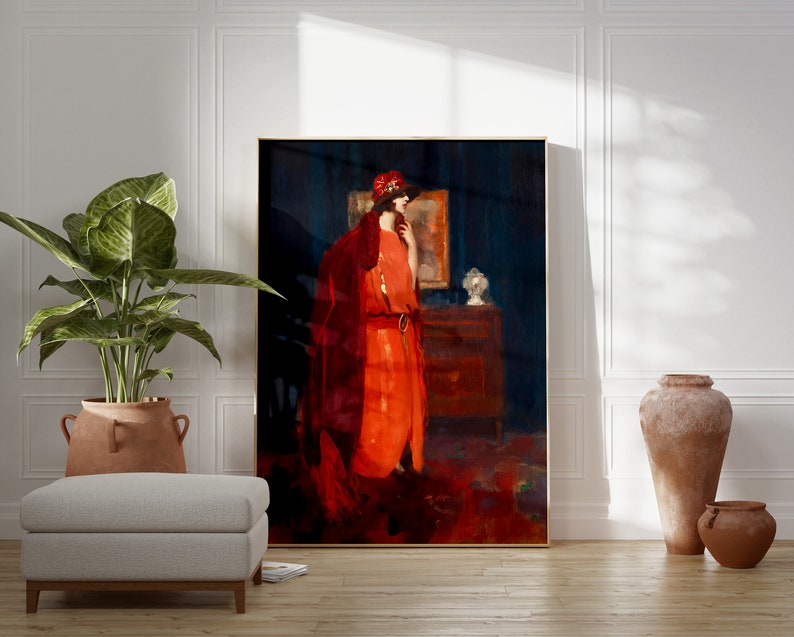 May include: A framed painting of a woman in a red dress and hat standing in a room with a dark blue wall and a mirror on the wall behind her.