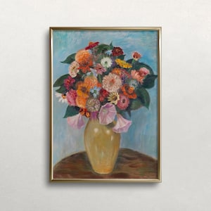 May include: A framed oil painting of a bouquet of colorful flowers in a yellow vase. The flowers are arranged in a loose, natural style and include pink, red, orange, yellow, and white blooms. The vase is sitting on a wooden table.