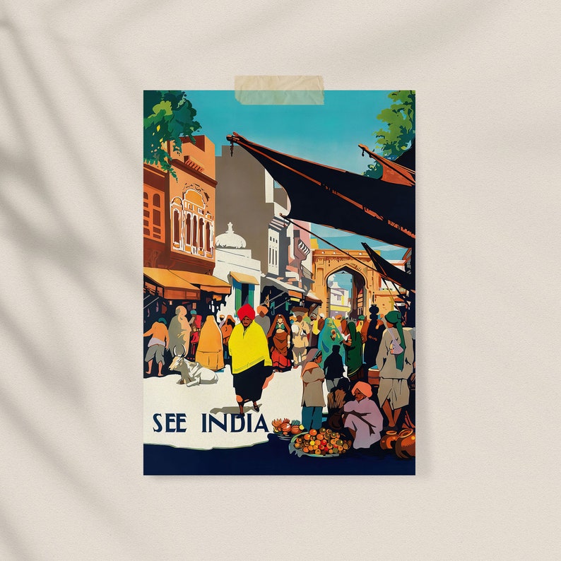 May include: A vintage travel poster with the text "SEE INDIA" depicts a bustling street scene. People in colorful clothing and turbans are gathered near buildings and a large archway. The poster has a retro travel aesthetic.