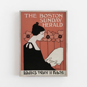 May include: Framed vintage poster with a woman in profile reading a paper. The poster reads "THE BOSTON SUNDAY HERALD" and "Ladies Want it Feb 24". The background is salmon with floral accents.