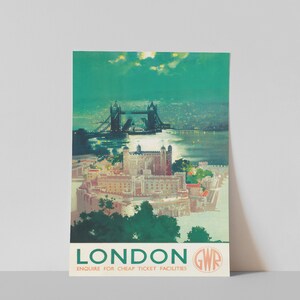 May include: A vintage travel poster advertising travel to London, England. The poster features a nighttime view of the Tower Bridge and the Tower of London. The poster is in green, blue, and white colors. The text on the poster reads "London GWR Enquire for cheap ticket facilities."