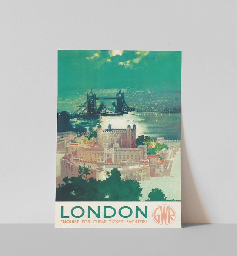 May include: A vintage travel poster advertising travel to London, England. The poster features a nighttime view of the Tower Bridge and the Tower of London. The poster is in green, blue, and white colors. The text on the poster reads "London GWR Enquire for cheap ticket facilities."