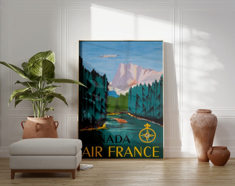 May include: A vintage travel poster for Air France featuring a mountain landscape with a plane flying overhead. The poster is in shades of blue, green, and brown with the text "Canada Air France" in gold lettering.