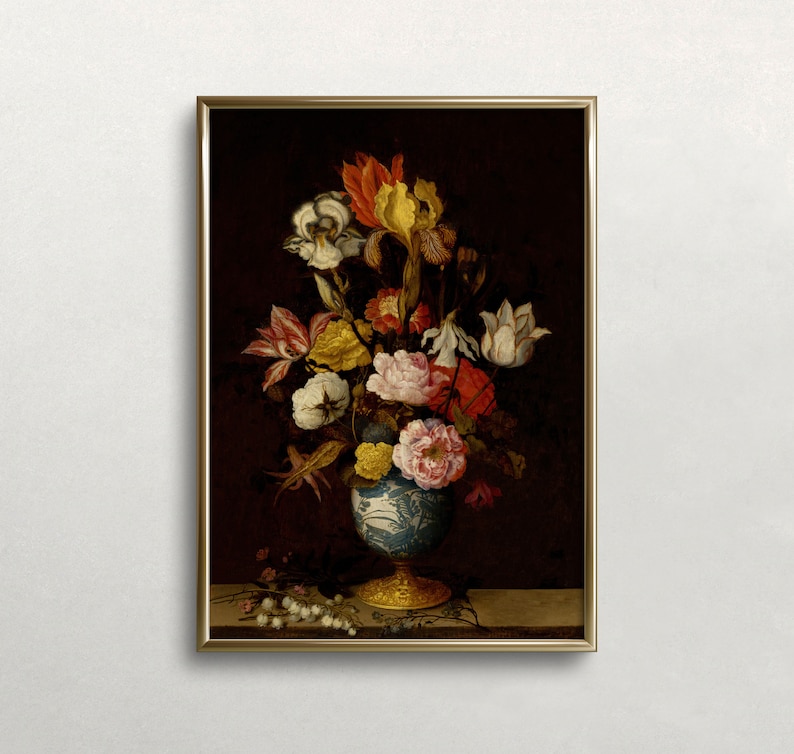 May include: A framed floral still life painting featuring a vibrant bouquet of flowers in a blue and white vase with a gold base. The flowers include irises, roses, and tulips in shades of red, yellow, and white. The background is a dark brown.