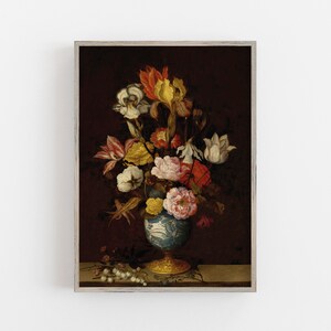May include: A framed print of a still life floral arrangement. The bouquet features a variety of flowers in shades of white, yellow, orange, and pink, arranged in a blue and white vase with a gold base. The background is a dark burgundy.
