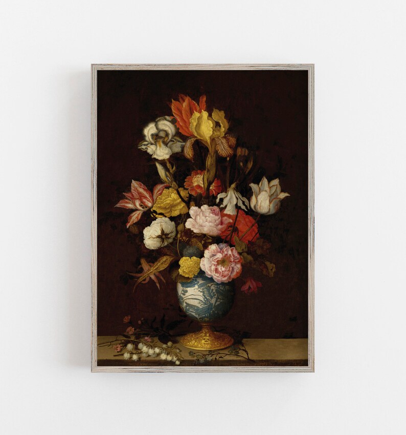 May include: A framed print of a still life floral arrangement. The bouquet features a variety of flowers in shades of white, yellow, orange, and pink, arranged in a blue and white vase with a gold base. The background is a dark burgundy.