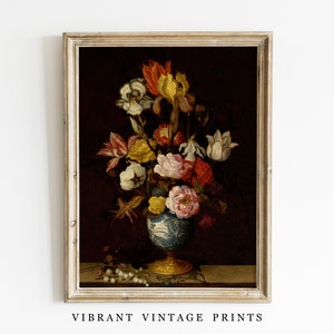 May include: A framed vintage print featuring a still life of colorful flowers in a blue and white vase with a gold base. The flowers include red, yellow, and white blooms against a dark background. The text "VIBRANT VINTAGE PRINTS" is at the bottom.
