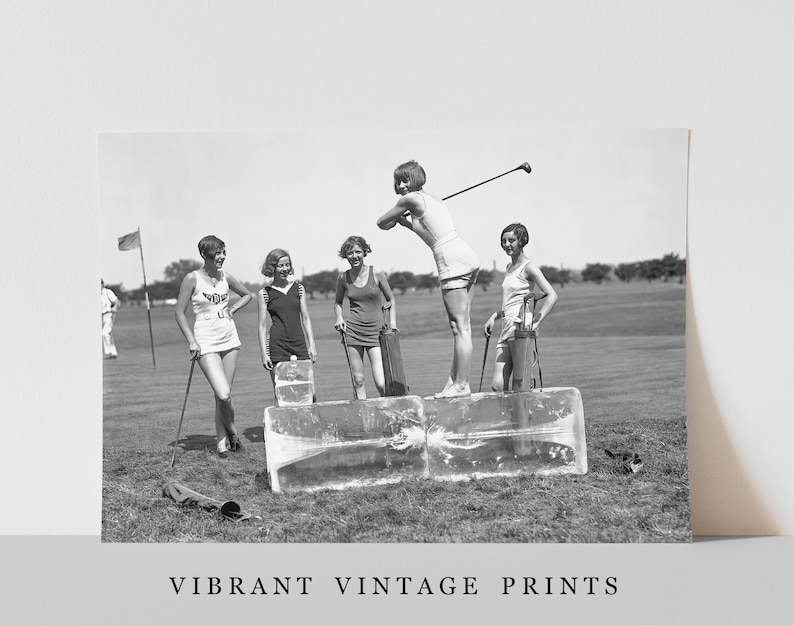 May include: Five women in vintage clothing stand on a golf course. They are holding golf clubs and bags. The women are standing on blocks of ice. The image is in black and white.