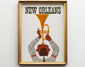 May include: A framed art print featuring the text NEW ORLEANS in dark green letters above a stylized illustration of a person playing a golden trumpet. The person wears a white shirt with thin black vertical stripes and red sleeve bands.