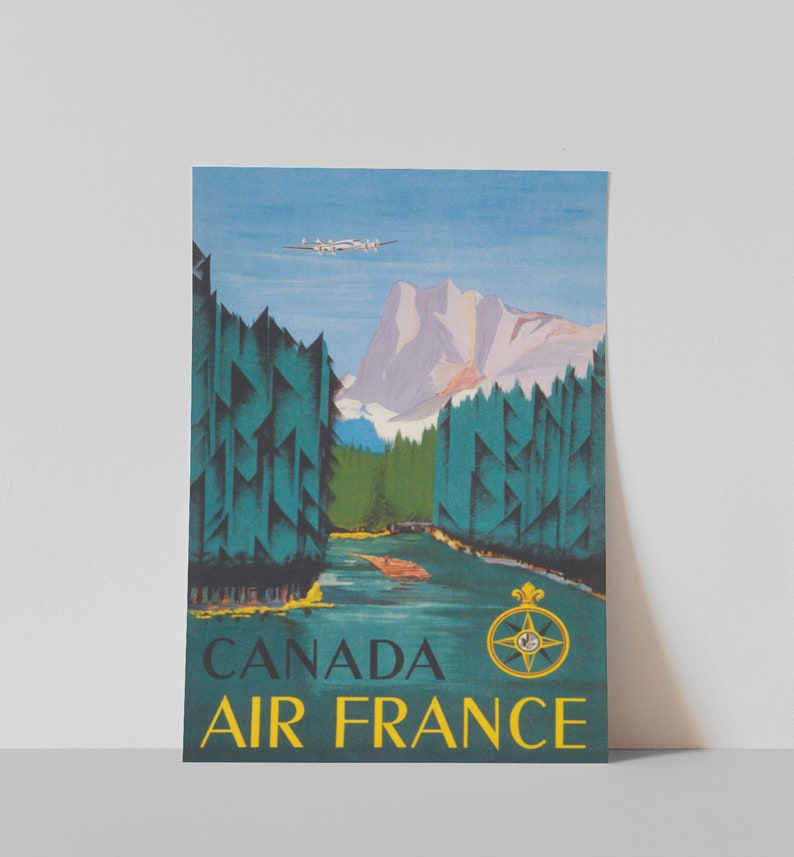 May include: Vintage travel poster advertising Air France flights to Canada. The poster features a blue sky, a mountain range, a river, and a plane flying overhead. The text "CANADA AIR FRANCE" is in yellow letters at the bottom of the poster.