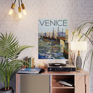 May include: A poster titled "Venice" depicts a row of gondolas on the water. The artwork features a blue and brown color palette, with the word "Venice" in large, bold letters at the top. The gondolas are lined up along the water's edge.