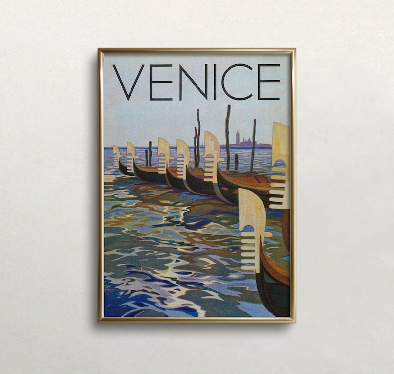 May include: A framed print featuring the word "VENICE" above a row of gondolas on the water. The artwork has a vintage travel poster style, with a gold frame and a serene depiction of the Italian city.