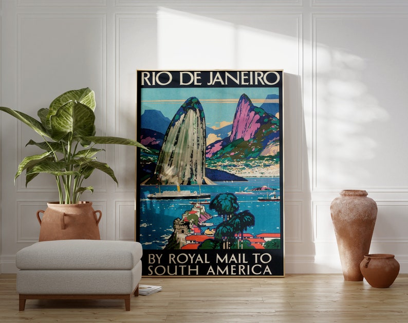 May include: Vintage travel poster advertising travel to Rio de Janeiro by Royal Mail to South America. The poster features a colorful illustration of Sugarloaf Mountain and Guanabara Bay.