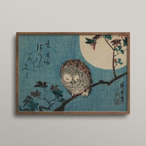 May include: A vintage Japanese woodblock print depicting an owl perched on a branch with a full moon in the background. The print is framed in a brown wood frame. The text in the image reads "夜ふかし" which translates to "staying up late".