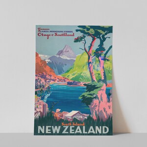 May include: Vintage travel poster advertising the South Island of New Zealand, featuring a scenic view of mountains, a lake, and trees. The text reads "Famous Lakes, Mountains, Fiords Otago & Southland South Island NEW ZEALAND".