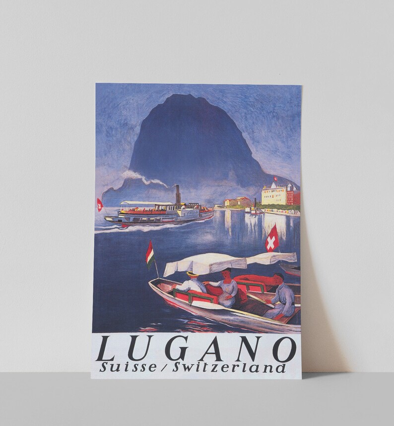 May include: A retro travel poster for Lugano, Switzerland, depicting a lake scene with boats and a mountain. The poster has a vintage style with the word "LUGANO" and the text "Suisse / Switzerland" below, in a classic font.