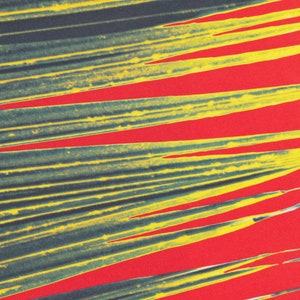 May include: Abstract art print featuring a vibrant composition of overlapping, diagonal lines. The lines are a mix of yellow and teal, set against a bold red background, creating a striking visual contrast.