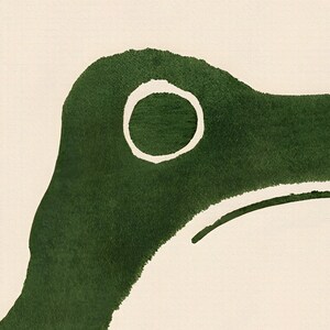 May include: Abstract watercolor painting of a green shape with a white circle in the center. The shape resembles a bird's head.