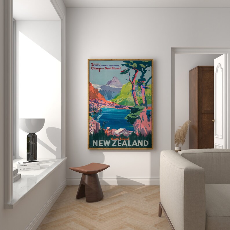 May include: A vintage travel poster for New Zealand, featuring a scenic view of a lake and mountains with a vibrant color palette. The poster text reads "Tourist Lakes & Mountains Tours Otago & Southland South Island NEW ZEALAND".