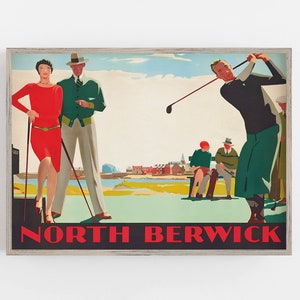 May include: Vintage-style framed print featuring a golf scene with figures in period attire. A woman in a red dress and a man in a green jacket stand near a golf course. The words "NORTH BERWICK" are displayed in bold red letters.