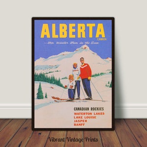 May include: A vintage travel poster advertising winter fun in Alberta, Canada. The poster features a family of three skiing down a mountain slope with a blue sky and snow-capped mountains in the background. The text on the poster reads "ALBERTA...For Winter Fun in the Sun" and lists the Canadian Rockies, Waterton Lakes, Lake Louise, Jasper, and Banff.