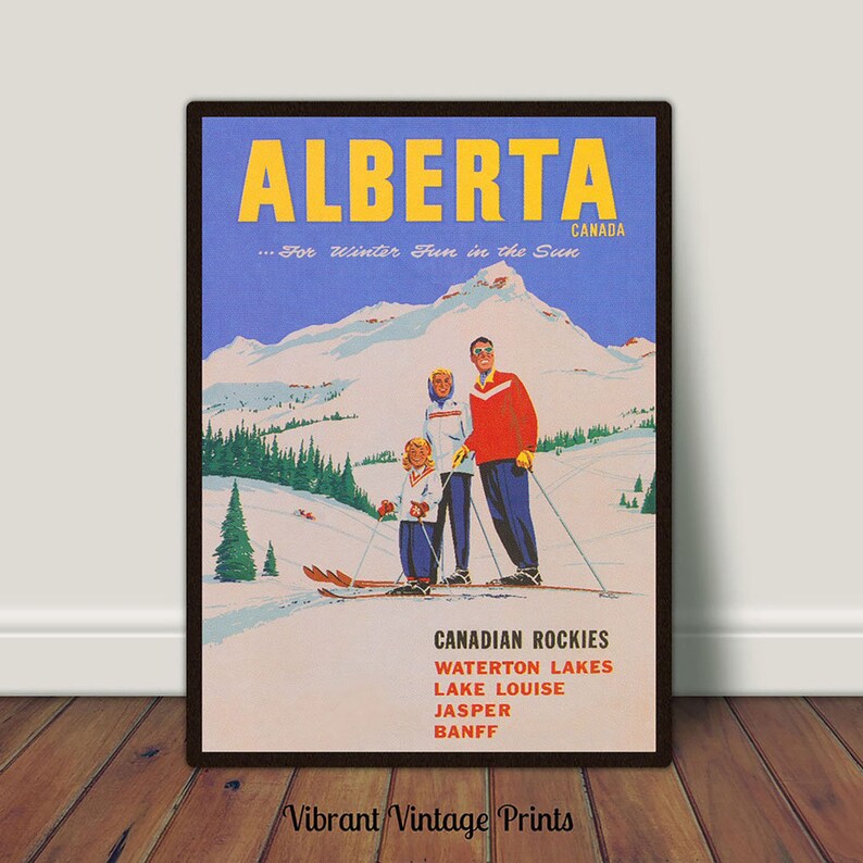 May include: A vintage travel poster advertising winter fun in Alberta, Canada. The poster features a family of three skiing down a mountain slope with a blue sky and snow-capped mountains in the background. The text on the poster reads "ALBERTA...For Winter Fun in the Sun" and lists the Canadian Rockies, Waterton Lakes, Lake Louise, Jasper, and Banff.