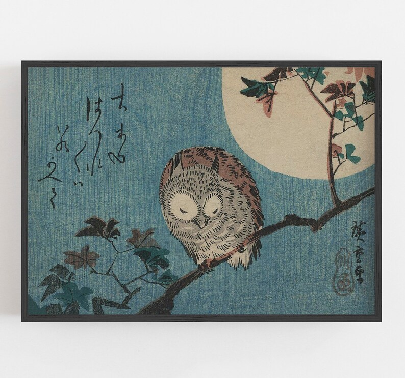 May include: A woodblock print of an owl perched on a branch with a full moon in the background. The owl is brown and gray with its eyes closed. The branch is bare except for a few leaves. The moon is a pale yellow and the background is a light blue. The print is signed in Japanese characters.